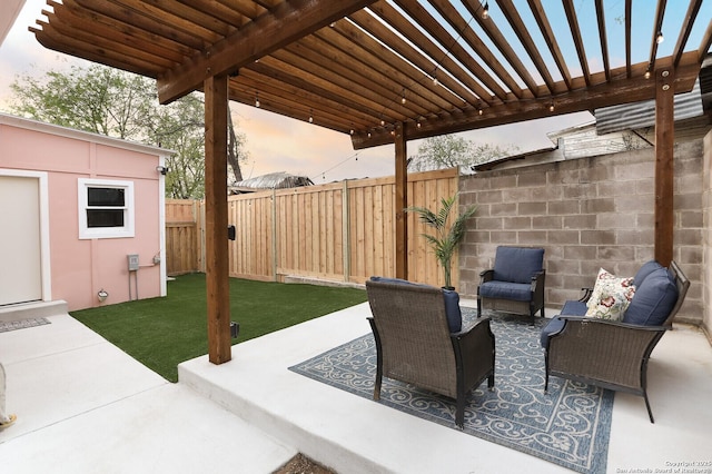 patio terrace at dusk featuring fence, a pergola, and a lawn