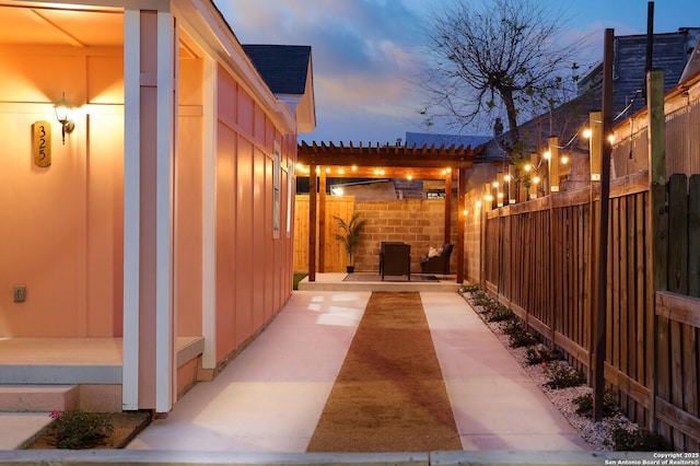 view of patio / terrace featuring fence and a pergola