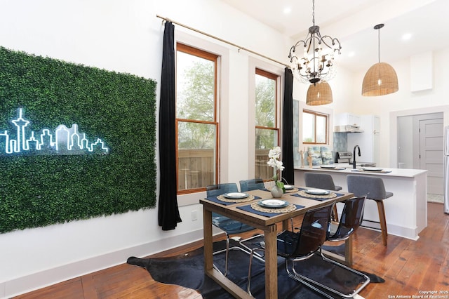 dining room featuring a notable chandelier and hardwood / wood-style flooring