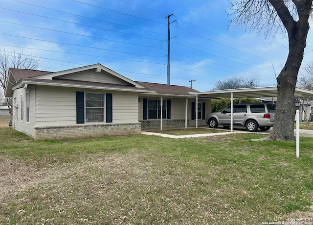 ranch-style house with brick siding, a front lawn, and a carport