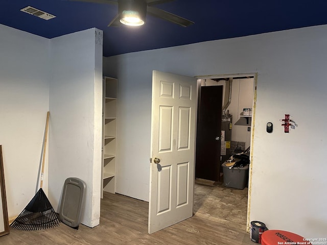 interior space featuring visible vents and water heater