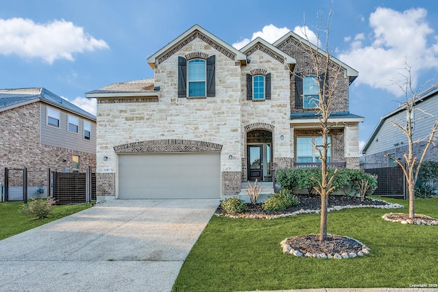 french country home with driveway, stone siding, fence, an attached garage, and a front yard