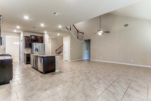 kitchen featuring ceiling fan, stainless steel appliances, visible vents, and a kitchen island with sink