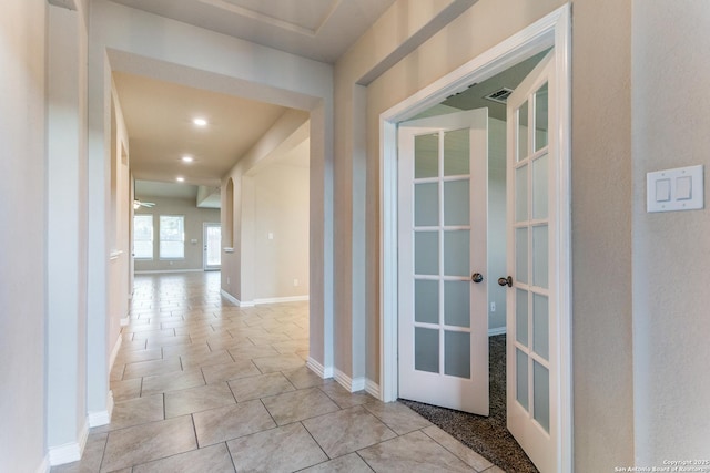 hall featuring visible vents, recessed lighting, french doors, light tile patterned floors, and baseboards