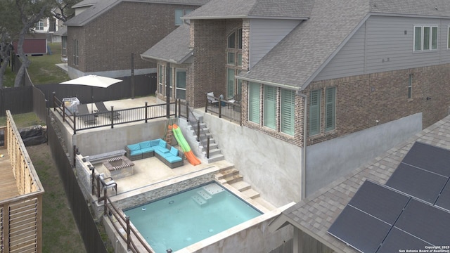 view of pool with a patio area, an outdoor living space, and a fenced backyard