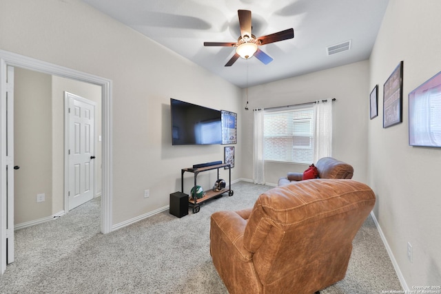 living room featuring carpet, baseboards, visible vents, and ceiling fan