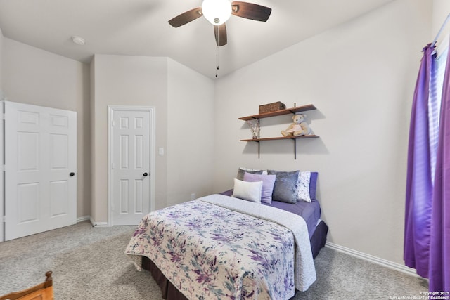 bedroom featuring a ceiling fan, light colored carpet, and baseboards