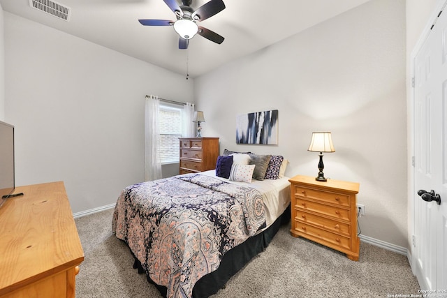 bedroom featuring visible vents, baseboards, carpet, and a ceiling fan