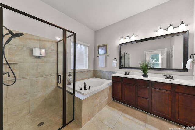 bathroom with a bath, a stall shower, double vanity, and a sink