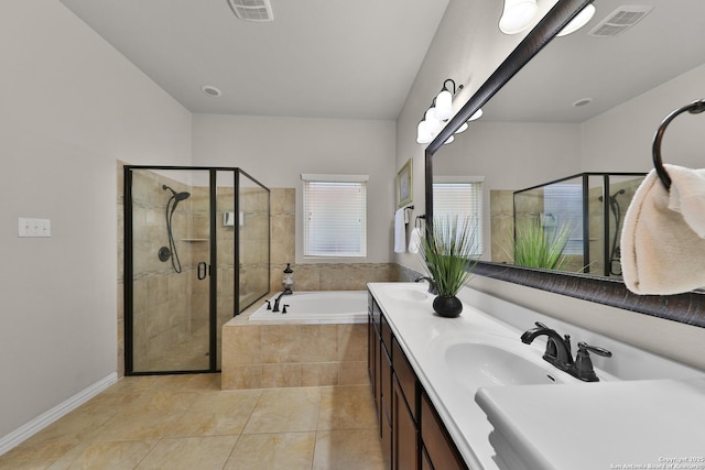 bathroom featuring a sink, visible vents, a garden tub, and a stall shower