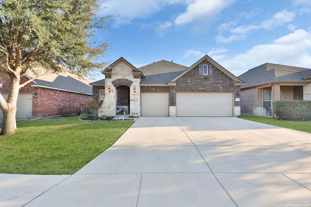 view of front facade with a front yard, a shingled roof, concrete driveway, a garage, and brick siding