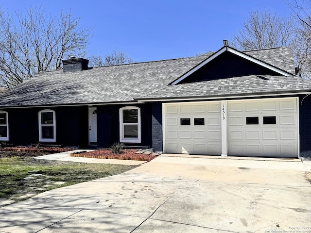 ranch-style home featuring a shingled roof, a garage, driveway, and a chimney