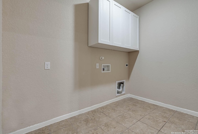 washroom with washer hookup, cabinet space, baseboards, and hookup for an electric dryer