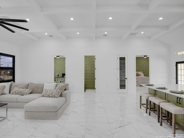 living room featuring visible vents, beamed ceiling, high vaulted ceiling, and a ceiling fan