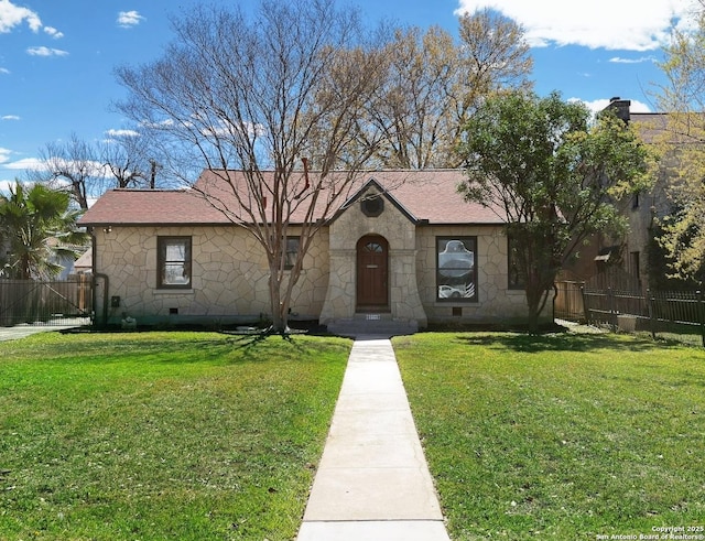 view of front facade featuring fence, stone siding, and crawl space