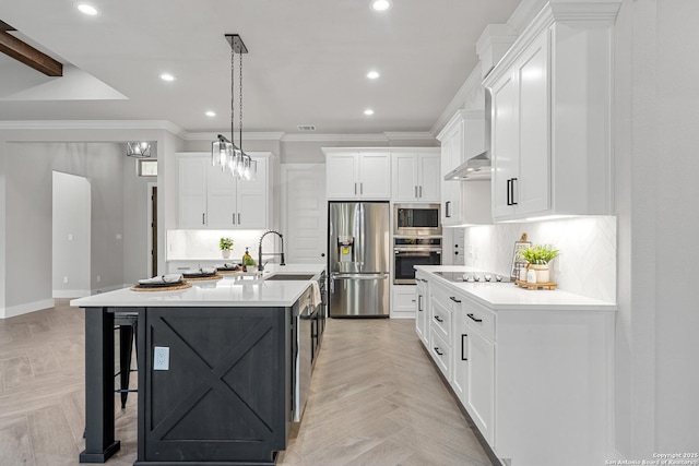 kitchen featuring a sink, tasteful backsplash, appliances with stainless steel finishes, crown molding, and light countertops