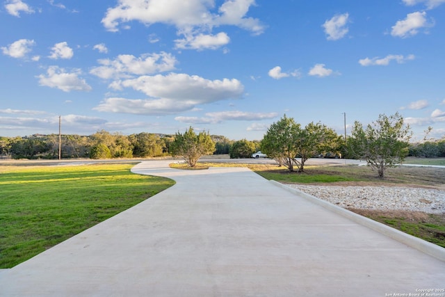 view of community featuring a lawn