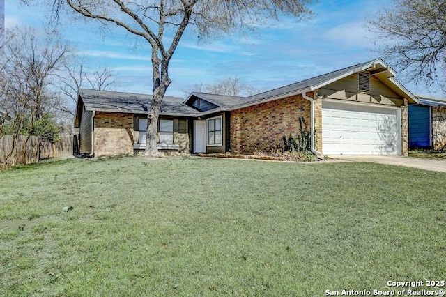 view of front of property with fence, an attached garage, a front lawn, concrete driveway, and brick siding