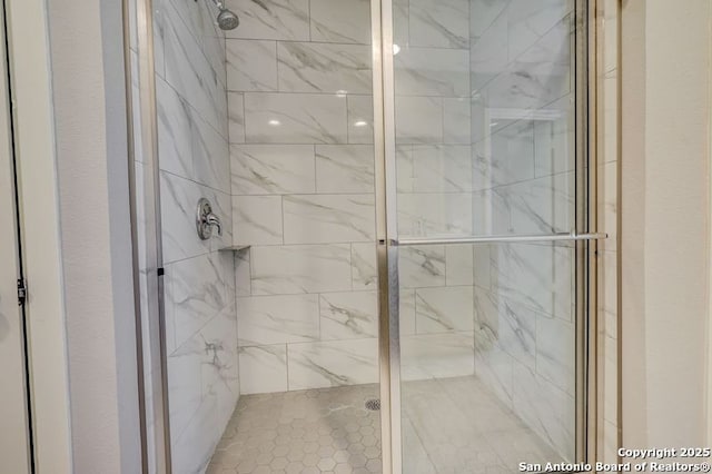 bathroom with a shower stall