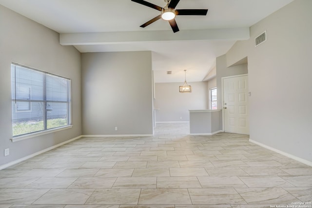 empty room with lofted ceiling with beams, visible vents, baseboards, and a ceiling fan