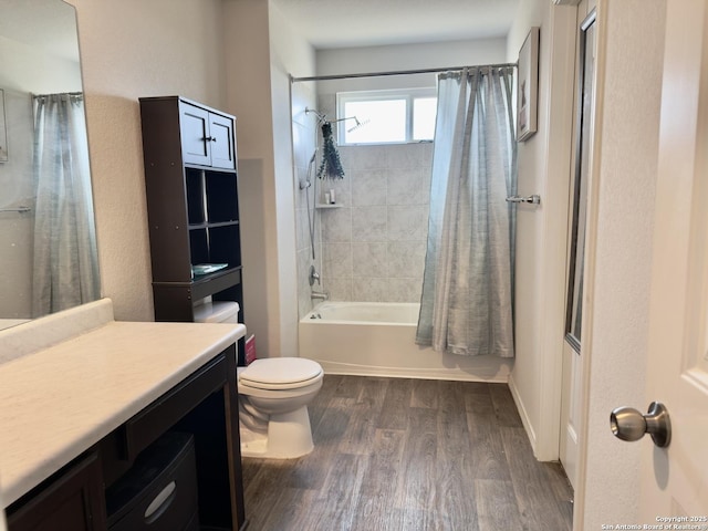 bathroom with vanity, toilet, shower / tub combo with curtain, and wood finished floors