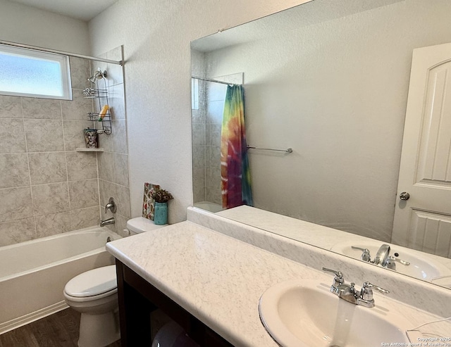 full bathroom featuring vanity, toilet, shower / tub combo with curtain, and wood finished floors