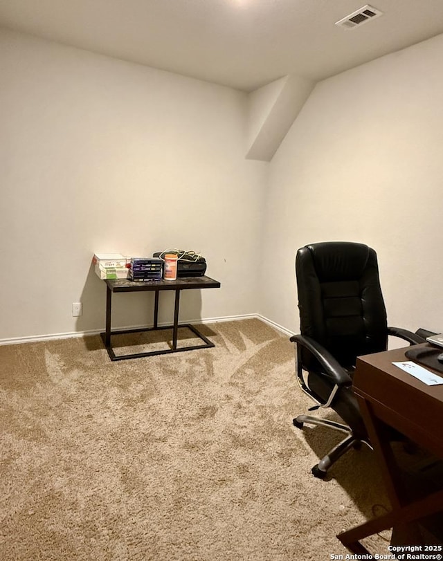 office area featuring visible vents, baseboards, and carpet