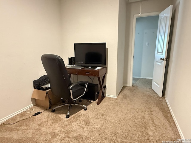 office space with attic access, carpet flooring, and baseboards