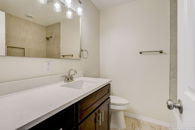 full bath with baseboards, toilet, walk in shower, and vanity