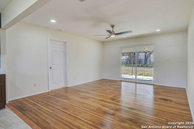 unfurnished living room with recessed lighting, baseboards, wood finished floors, and a ceiling fan