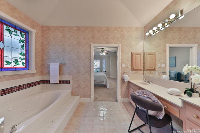 ensuite bathroom featuring tile patterned floors, vanity, ensuite bathroom, and vaulted ceiling