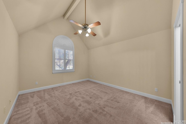 interior space featuring baseboards, vaulted ceiling with beams, carpet, and ceiling fan