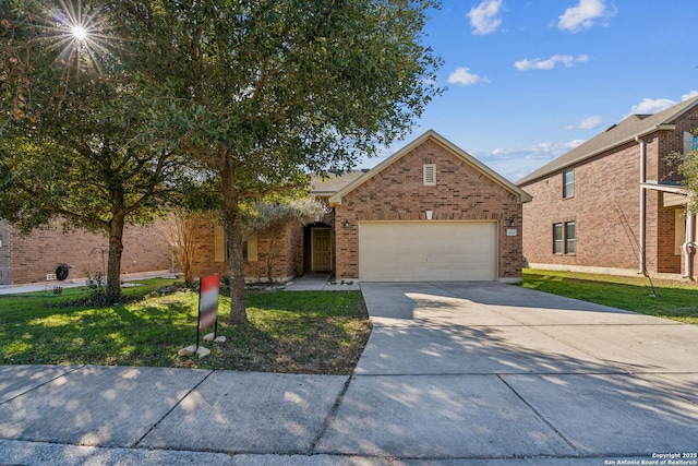 traditional-style house with a front yard, brick siding, an attached garage, and driveway