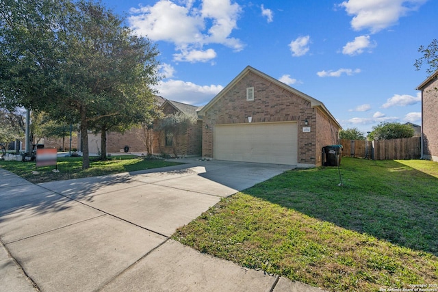 view of front of home with fence, an attached garage, concrete driveway, a front lawn, and brick siding