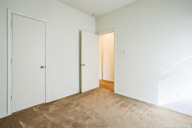 unfurnished bedroom featuring carpet floors