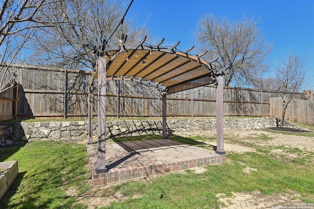 view of yard featuring a patio, a pergola, and a fenced backyard