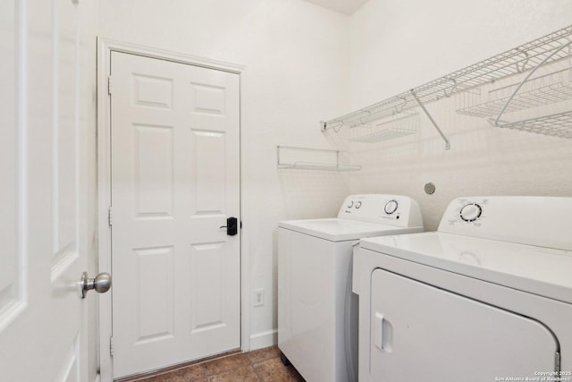 clothes washing area with laundry area and washing machine and clothes dryer