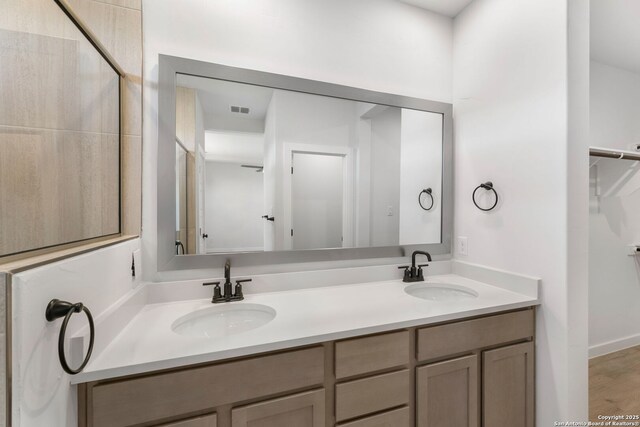 13223 Edith Gdns, San Antonio, TX 78253 - full bath featuring a sink, visible vents, and double vanity