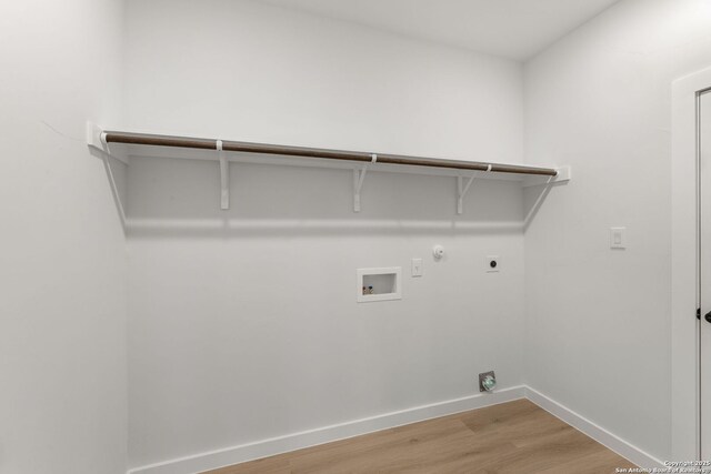 13223 Edith Gdns, San Antonio, TX 78253 - clothes washing area featuring baseboards, gas dryer hookup, laundry area, light wood-style floors, and electric dryer hookup
