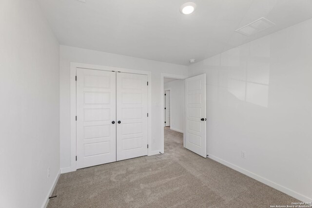 13223 Edith Gdns, San Antonio, TX 78253 - unfurnished bedroom with a closet, visible vents, baseboards, and carpet floors