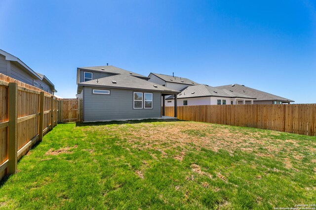 13223 Edith Gdns, San Antonio, TX 78253 - rear view of house with a yard and a fenced backyard