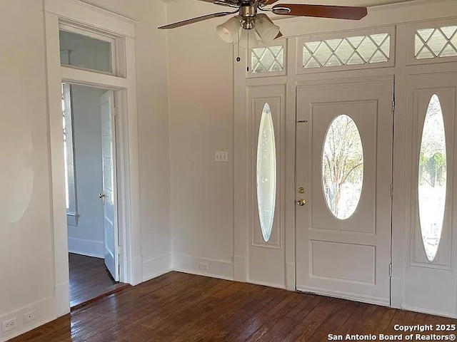 foyer featuring dark wood-style floors, plenty of natural light, and ceiling fan