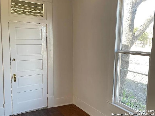 interior space with baseboards and a wealth of natural light