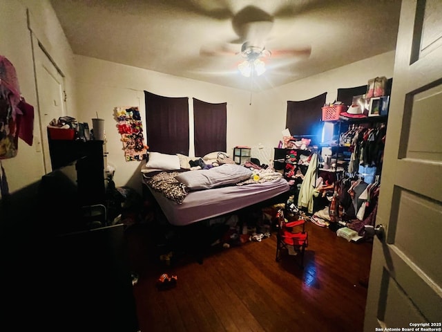 bedroom featuring wood finished floors and ceiling fan