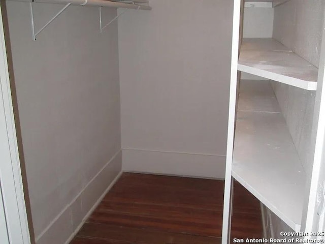 spacious closet with wood finished floors