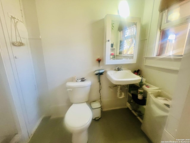 bathroom featuring toilet and a sink