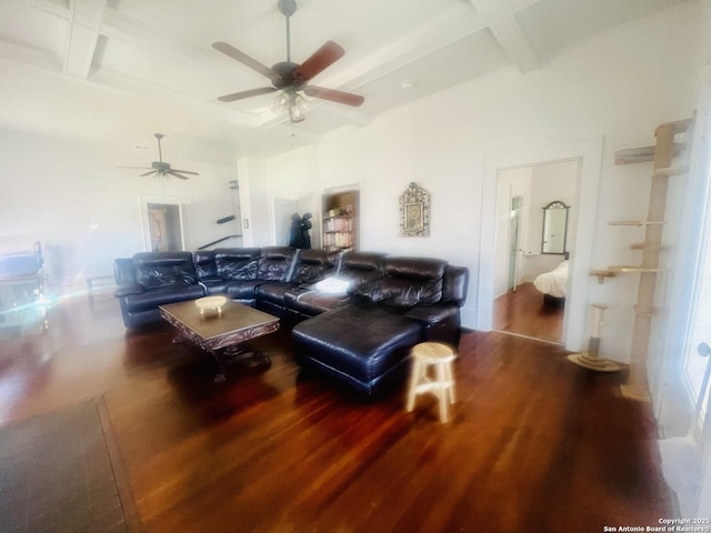 living room with beam ceiling, coffered ceiling, wood finished floors, and a ceiling fan