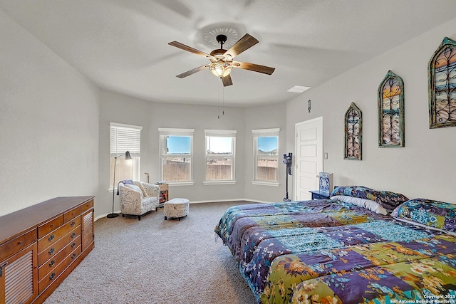 carpeted bedroom featuring a ceiling fan and baseboards