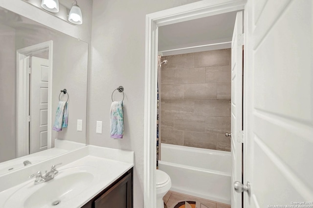 bathroom with shower / bathtub combination with curtain, toilet, vanity, and tile patterned flooring