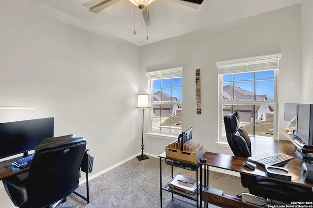 office area featuring baseboards, ceiling fan, and carpet flooring